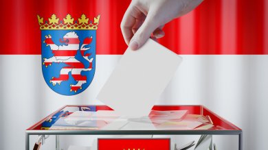 Hesse flag, hand dropping ballot card into a box - voting/ elect Hesse flag, hand dropping ballot card into a box - voting/ elect